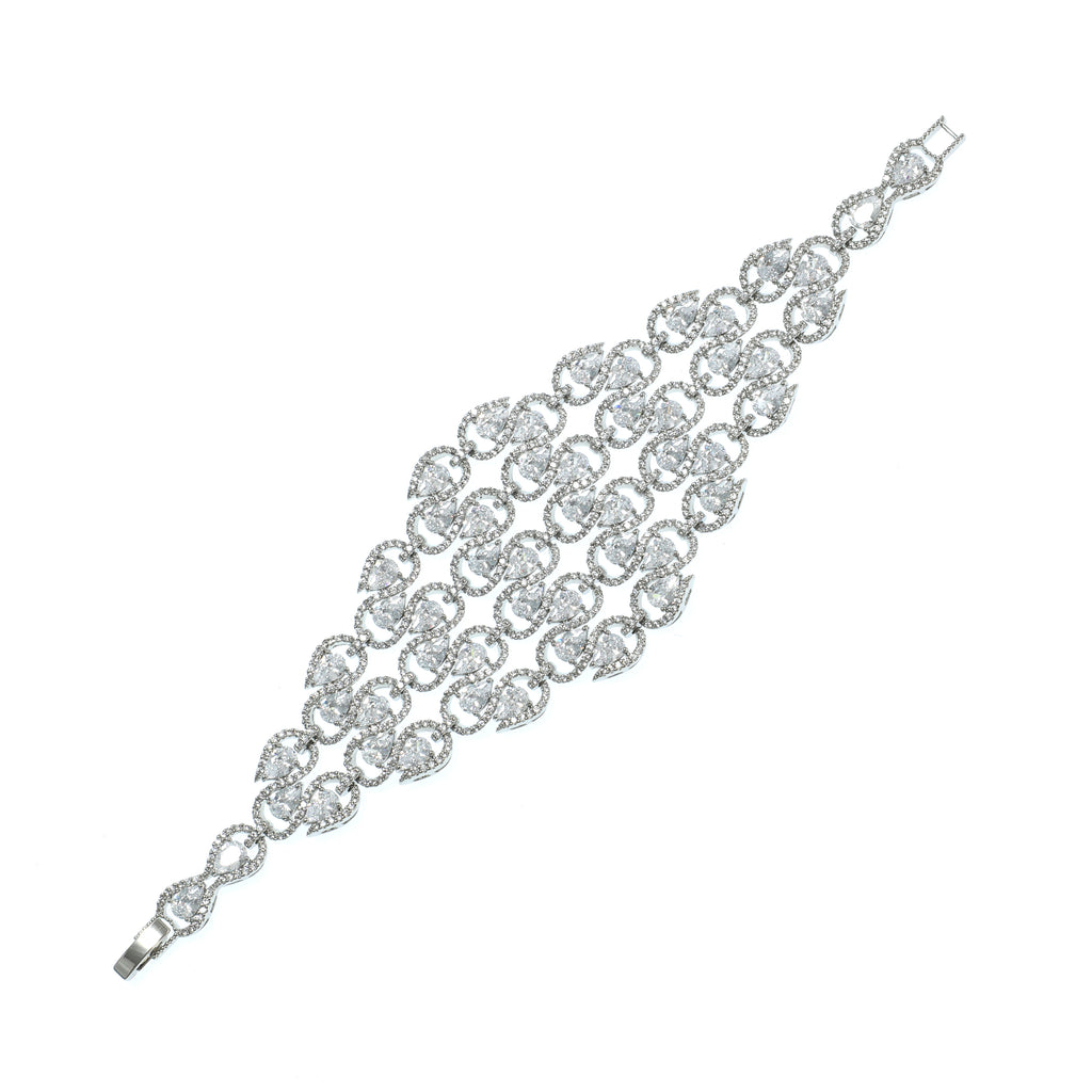 Silver bracelet with clear gemstones on a white background