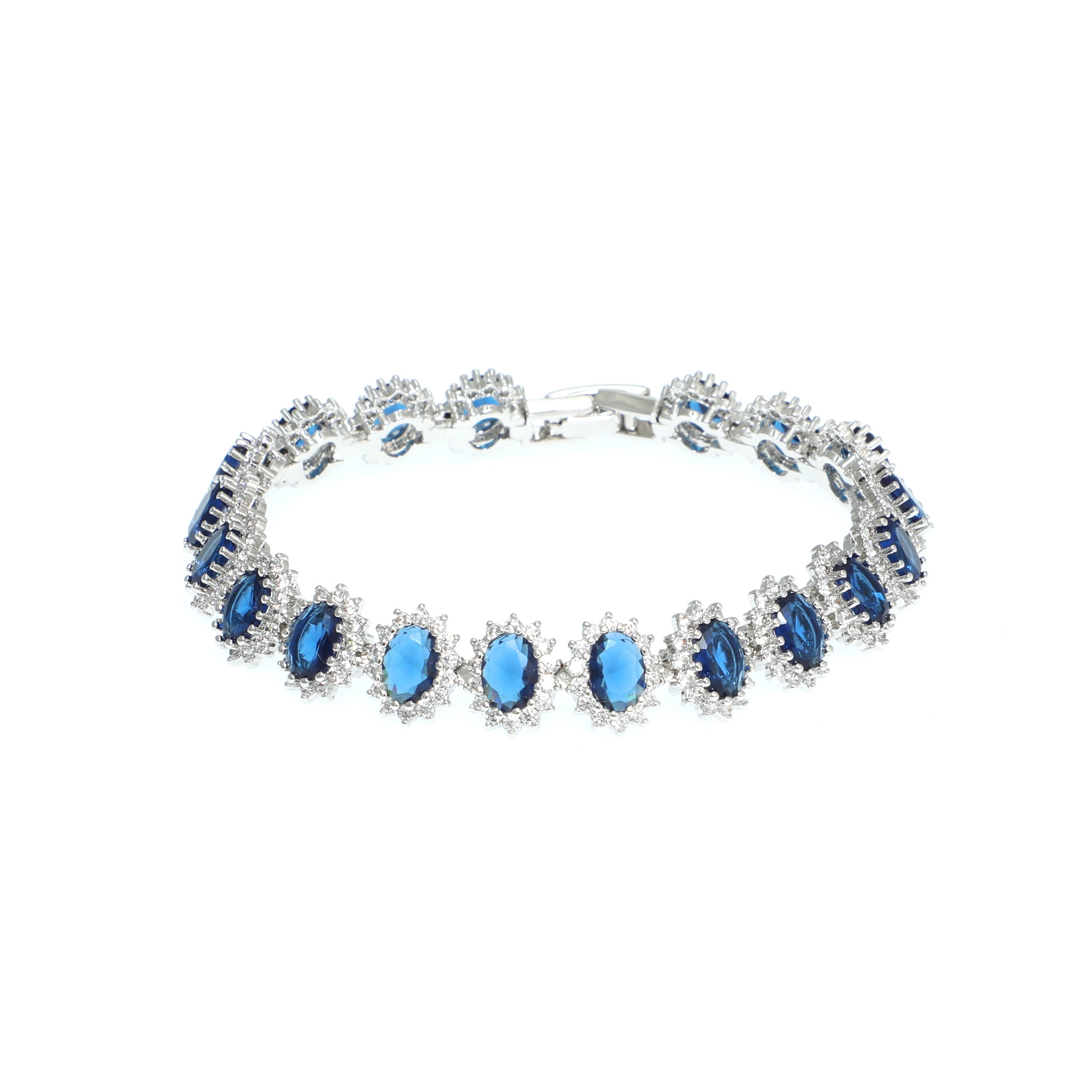 Silver bracelet with blue gemstones on a white background